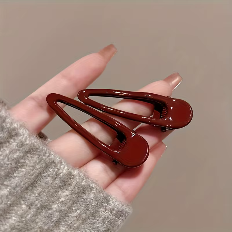 2 pinces à cheveux bordeaux