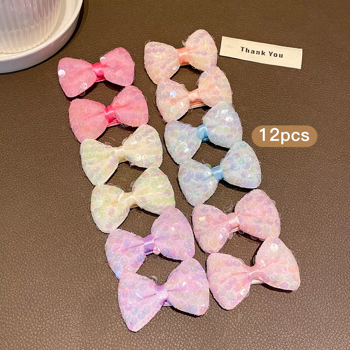 12 pinces à cheveux avec nœud à paillettes colorées