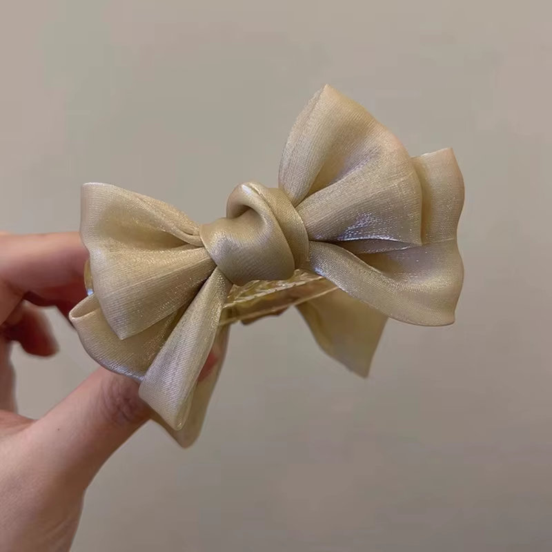 Pince à cheveux élégante pour chignon avec nœud papillon