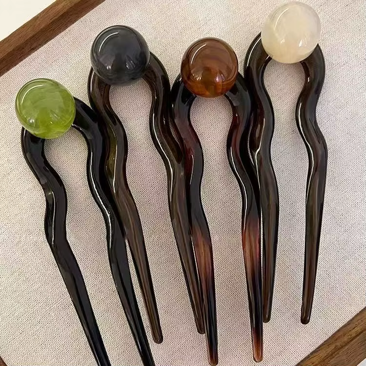 Bâtonnets de cheveux en perles